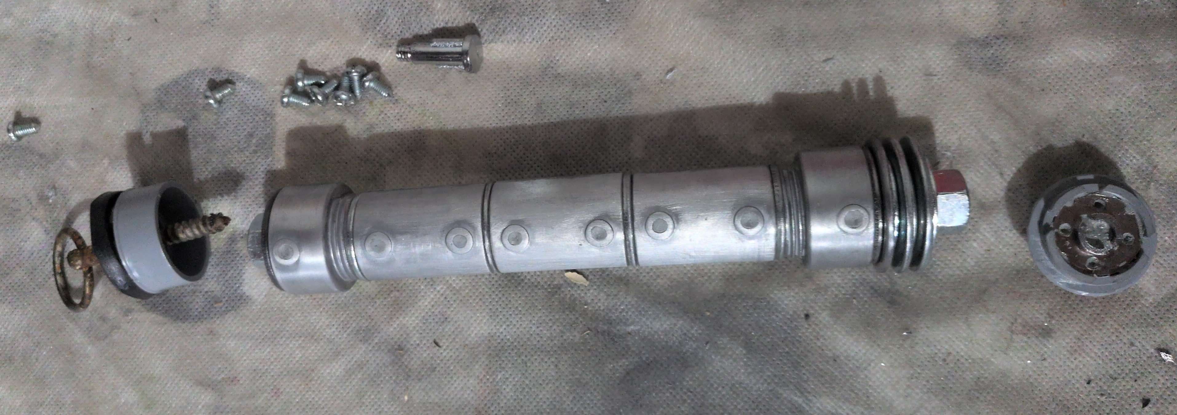 Roughly sanded hilt shown with unattached pommel and emitter